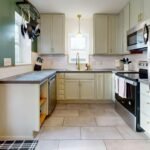 Bright modern kitchen with stainless steel appliances and elegant design.